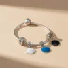 bracelet pandora avec 3 charms connectés de forme ronde avec puce NFC de la marque Joylink